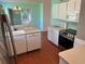 Well-equipped kitchen with modern appliances, white cabinetry, and ample counter space at 11014 Sw 73Rd Cir, Ocala, FL 34476