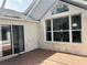 Enclosed patio features tile flooring, large windows, and sliding glass doors for natural light at 11014 Sw 73Rd Cir, Ocala, FL 34476