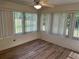 Bright sunroom with large windows providing ample natural light and a view of the outdoors at 11014 Sw 73Rd Cir, Ocala, FL 34476