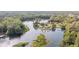 Breathtaking aerial shot of houses nestled among rivers, trees, and serene waters at 12180 Maple St, Dunnellon, FL 34432