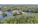 Panoramic aerial view of waterfront community enveloped by lush trees and tranquil waters at 12180 Maple St, Dunnellon, FL 34432