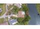 A high-angle shot features a home by the river with a long driveway and a well-maintained yard at 12180 Maple St, Dunnellon, FL 34432