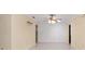Bright dining area featuring tiled flooring, ceiling fan, and ample wall space for decor at 12180 Maple St, Dunnellon, FL 34432