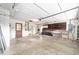 Spacious garage with ample storage shelving, and an automatic door opener at 12180 Maple St, Dunnellon, FL 34432