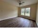 Neutral bedroom with a ceiling fan and a large window offering natural light at 13375 Se 42Nd Ave, Belleview, FL 34420