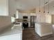 Bright kitchen featuring white cabinets, modern appliances, and countertop island at 13375 Se 42Nd Ave, Belleview, FL 34420