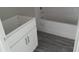Clean bathroom with white vanity, shower, and tub, offering a refreshing space at 2 Malauka Loop Ln, Ocklawaha, FL 32179