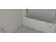 A bright white bathtub and shower combination, ready for tile and customization at 31 Fisher Run, Ocklawaha, FL 32179