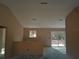 A spacious, unfinished kitchen ready for customization and featuring a sliding glass door at 31 Fisher Run, Ocklawaha, FL 32179