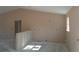 A bare living room featuring high, vaulted ceilings, fresh paint and a bright window at 31 Fisher Run, Ocklawaha, FL 32179