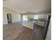 Bright, open-concept kitchen featuring a modern island, white cabinetry, and stainless steel appliances at 13269 Sw 112Th St, Dunnellon, FL 34432