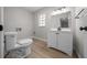 Bathroom with wood floors, sink, and toilet at 341 Se 53Rd Ct, Ocala, FL 34480