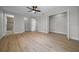 Large bedroom with wood floors, ceiling fan and double closets at 341 Se 53Rd Ct, Ocala, FL 34480