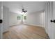 Light-filled bedroom with wood-look floors, ceiling fan and closet space at 341 Se 53Rd Ct, Ocala, FL 34480