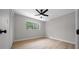 Bright bedroom with a ceiling fan and a window overlooking the yard at 341 Se 53Rd Ct, Ocala, FL 34480