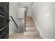 Bright entryway with hardwood stairs, modern railing and natural light streaming in at 341 Se 53Rd Ct, Ocala, FL 34480
