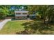 Inviting home with a lush green lawn, classic architecture, and mature trees at 341 Se 53Rd Ct, Ocala, FL 34480