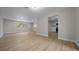 Spacious living room featuring wood flooring, fresh paint, and a view of the kitchen at 341 Se 53Rd Ct, Ocala, FL 34480