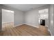 Open living room featuring hardwood floors, neutral paint, and an open layout at 341 Se 53Rd Ct, Ocala, FL 34480