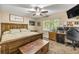 Comfortable bedroom featuring natural light, a ceiling fan, and neutral decor at 5118 Sw 197Th Ter, Dunnellon, FL 34431