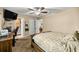 Well-lit bedroom featuring a bed, a desk, and easy access to both the bathroom and dining room at 5118 Sw 197Th Ter, Dunnellon, FL 34431