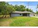 Single story home with a detached two-car garage and tree coverage at 5118 Sw 197Th Ter, Dunnellon, FL 34431