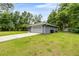Detached two-car garage with neutral paint and extra parking available at 5118 Sw 197Th Ter, Dunnellon, FL 34431