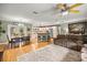 Open-concept living space with hardwood floors seamlessly connects the living room, dining area, and kitchen at 5118 Sw 197Th Ter, Dunnellon, FL 34431