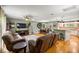 Inviting living room features hardwood floors, comfortable seating, and an open layout to the kitchen at 5118 Sw 197Th Ter, Dunnellon, FL 34431