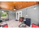 Cozy screened-in patio featuring a ceiling fan and outdoor seating, perfect for relaxing at 5118 Sw 197Th Ter, Dunnellon, FL 34431