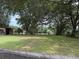 Fenced field with lush grass presents the extensive landscape and beautiful green space this property offers at 6020 Nw 2Nd Ave, Ocala, FL 34475