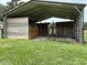 Sturdy metal horse shelter with fenced enclosures, providing ample space for animals at 6020 Nw 2Nd Ave, Ocala, FL 34475
