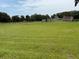 Spacious land with sheds and fencing, great for outdoor activities and storage at 6020 Nw 2Nd Ave, Ocala, FL 34475