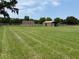 Green grassy land with farm buildings, ready for horses and other farm animals at 6020 Nw 2Nd Ave, Ocala, FL 34475
