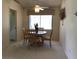 Bright dining room with a ceiling fan and a view of the outdoors at 9224 Sw 91St Cir, Ocala, FL 34481