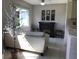 Cozy living area features a decorative tree, fireplace, and neutral tones at 9224 Sw 91St Cir, Ocala, FL 34481