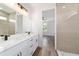 Contemporary bathroom featuring a double vanity, stone countertops, modern fixtures, and access to shower at 36 Pine Radl, Ocala, FL 34472
