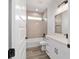 Bright bathroom featuring a tub, ceramic tile surround and modern fixtures, showcasing a clean design at 36 Pine Radl, Ocala, FL 34472