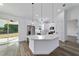 Spacious kitchen featuring a large island, stainless steel appliances, and white cabinets at 36 Pine Radl, Ocala, FL 34472