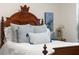 Close-up showcasing the bed with stylish headboard and pillows, adding a touch of elegance to the room at 4080 Sw 47Th Ct, Ocala, FL 34474