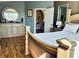 Bright bedroom showcasing wood floors, elegant decor, and a serene atmosphere at 9053 Sw 103Rd Ave, Ocala, FL 34481