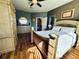 Spacious bedroom features a large window with plenty of sunlight, stylish decor and ensuite bathroom at 9053 Sw 103Rd Ave, Ocala, FL 34481