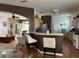 Kitchen with breakfast bar and bar stools, with sight lines into the living room at 9053 Sw 103Rd Ave, Ocala, FL 34481