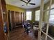 Inviting home office featuring hardwood floors, ceiling fan, decorative furnishings and plenty of natural light at 9053 Sw 103Rd Ave, Ocala, FL 34481