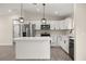 Modern kitchen featuring stainless steel appliances, white cabinets, and a center island at 14390 Sw 30 Pl, Ocala, FL 34481