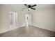 Bright main bedroom with en-suite bathroom and wood-style flooring at 14390 Sw 30 Pl, Ocala, FL 34481