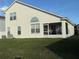 Back exterior of home showing screened in porch and fenced yard at 4853 Sw 53Rd Rd, Ocala, FL 34474