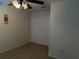 Bedroom features carpet floors, ceiling fan with lighting, and a closet with bi-fold doors at 4853 Sw 53Rd Rd, Ocala, FL 34474