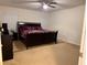 Comfortable bedroom with a ceiling fan, a comfortable bed and neutral carpeting at 4853 Sw 53Rd Rd, Ocala, FL 34474