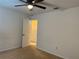 Bedroom with neutral walls, carpet flooring, and a ceiling fan with light fixture at 4853 Sw 53Rd Rd, Ocala, FL 34474